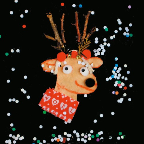 Reindeer with red scarf reading 'Noel'